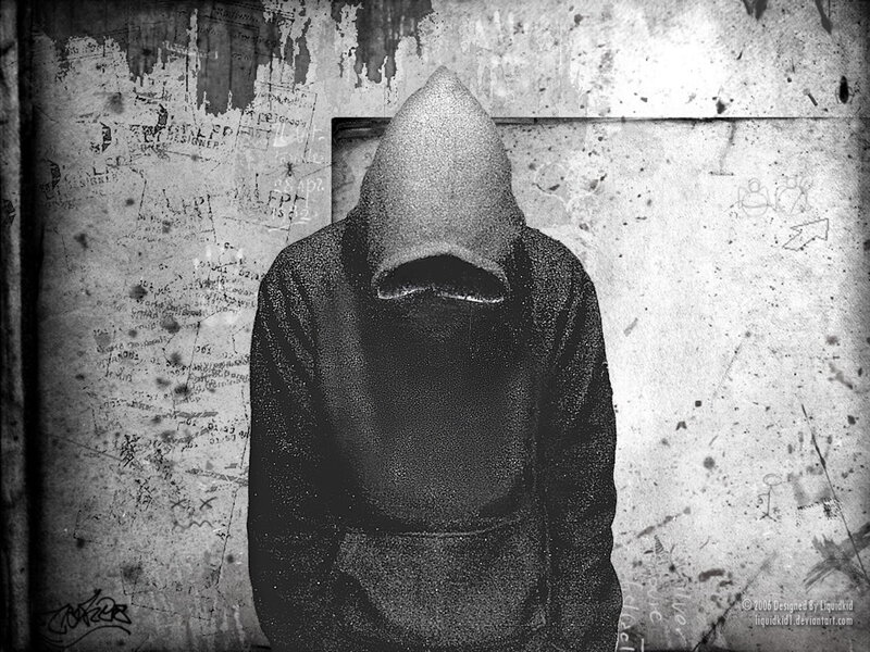 hooded figure in graffiti alley