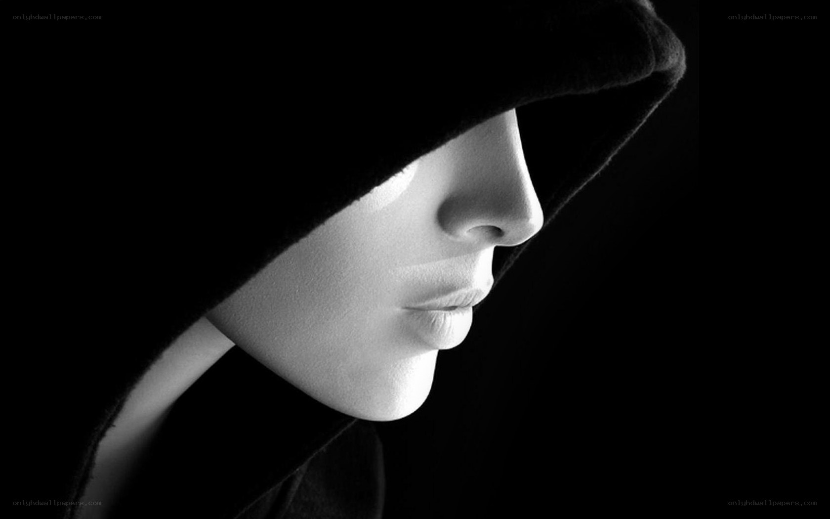hooded figure in profile