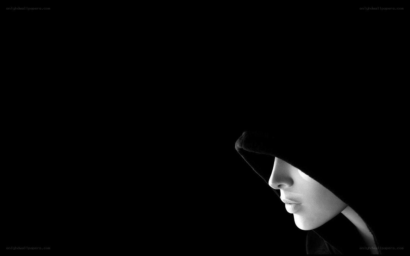 hooded figure in profile
