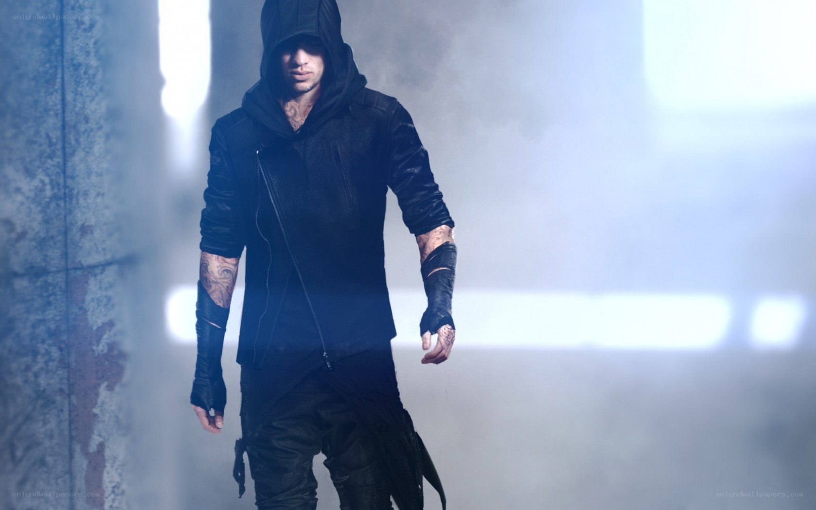 hooded figure in smoky corridor