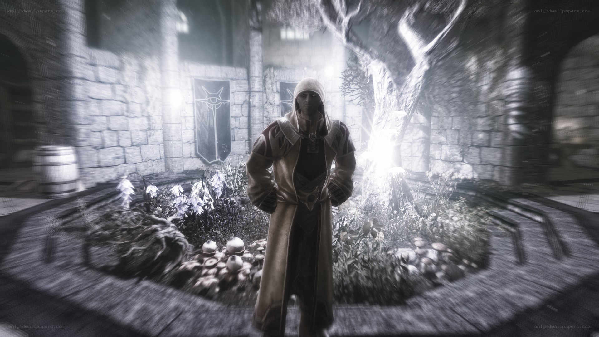 hooded figure in stone courtyard
