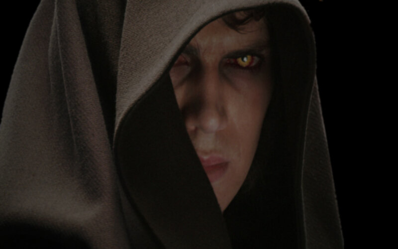 hooded figure with glowing eyes