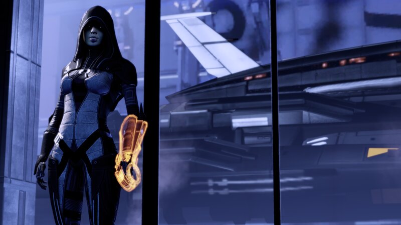 Hooded Figure with Glowing Gauntlet — Blue