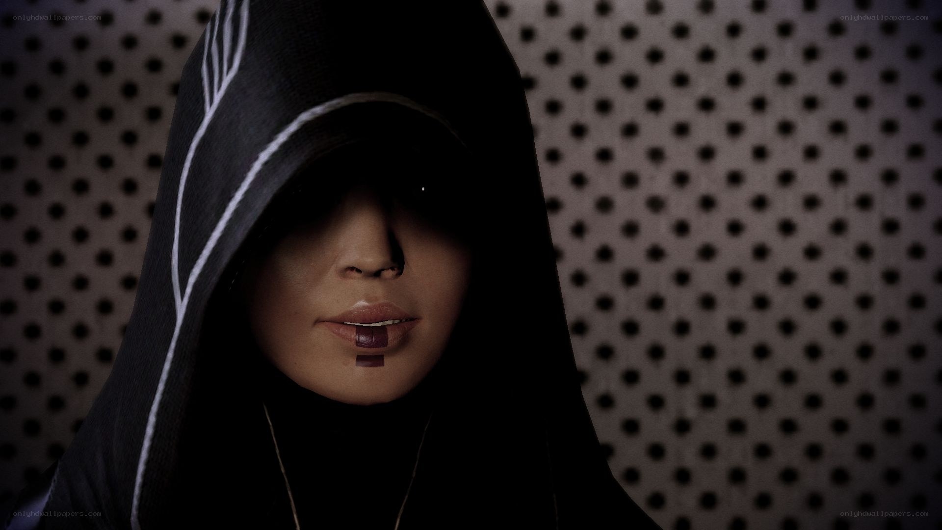 hooded figure with lip piercing