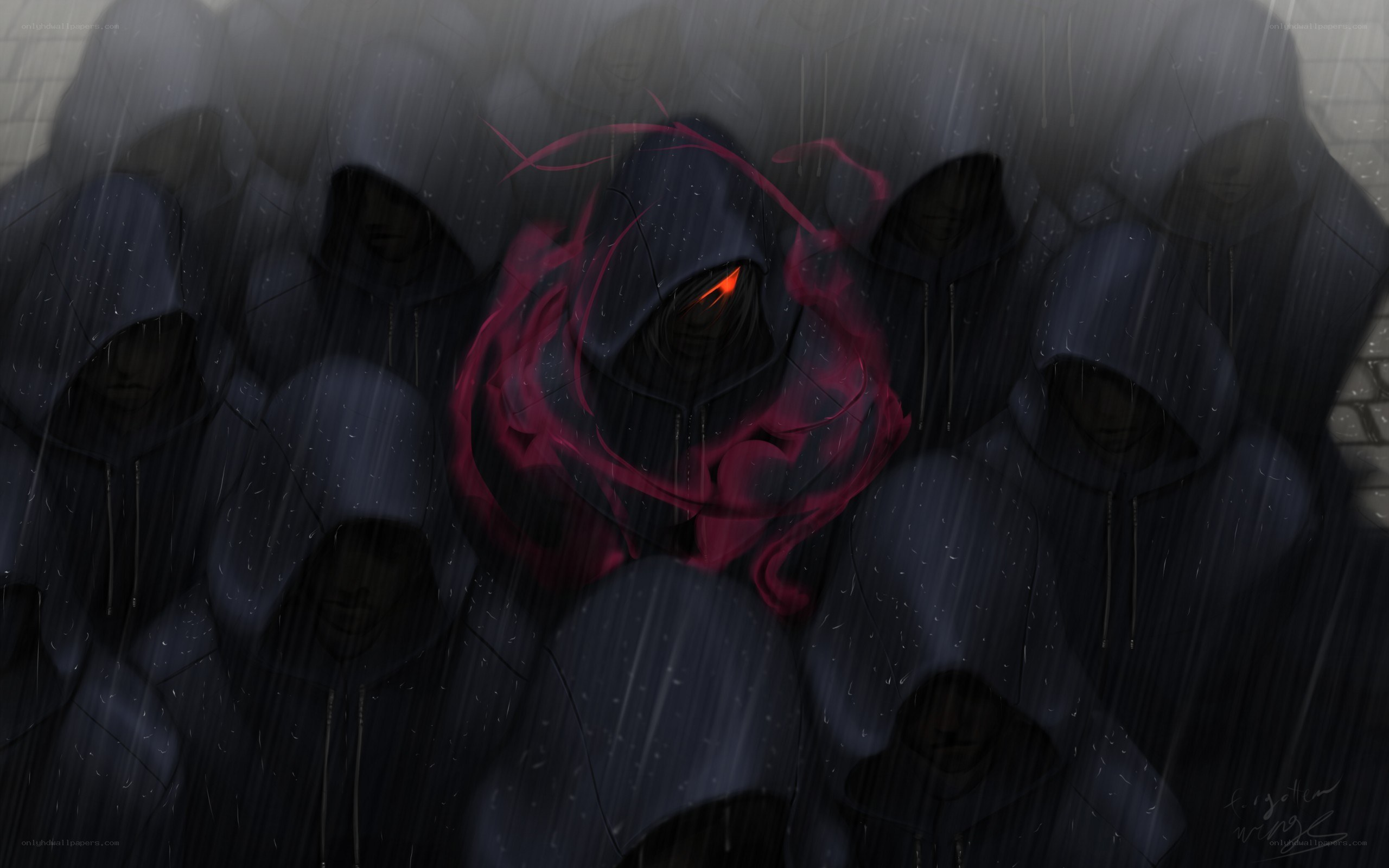 hooded figures in rain