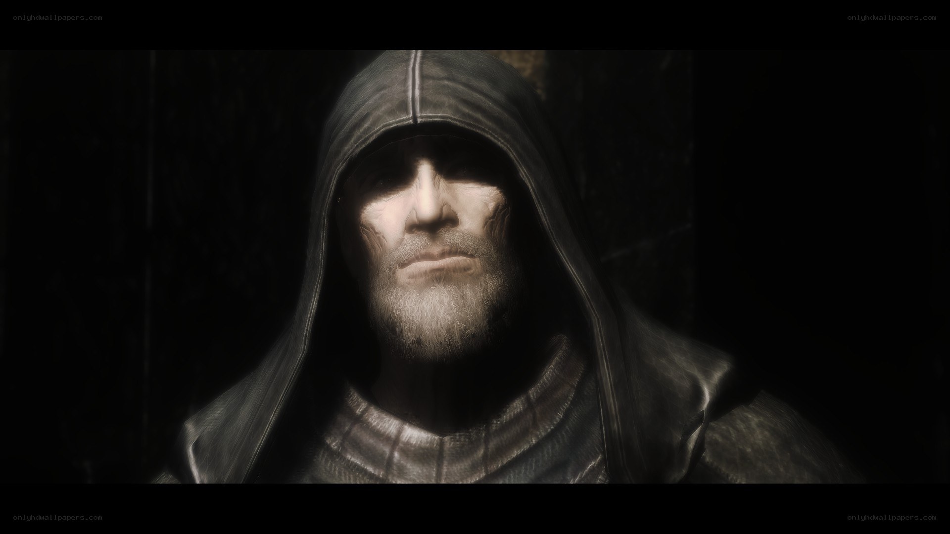 hooded man in dim light