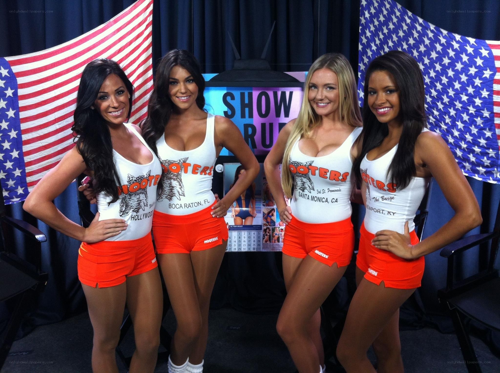 Hooters waitresses posing for photo