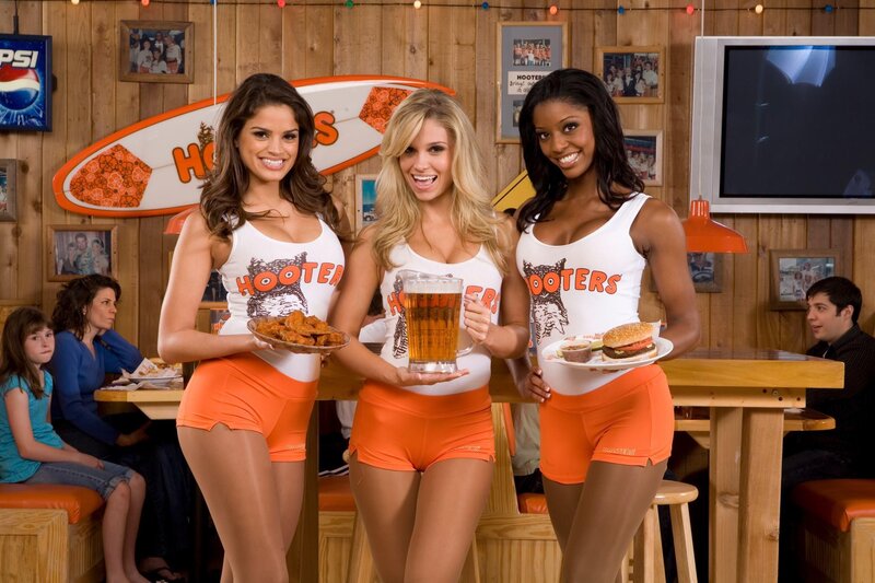 Hooters waitresses with food and drink