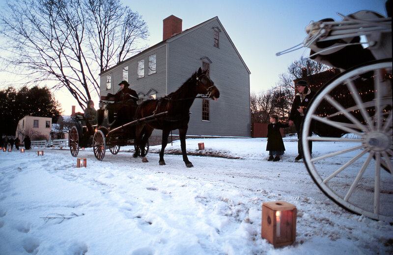 Horse-drawn carriage in snowy scene