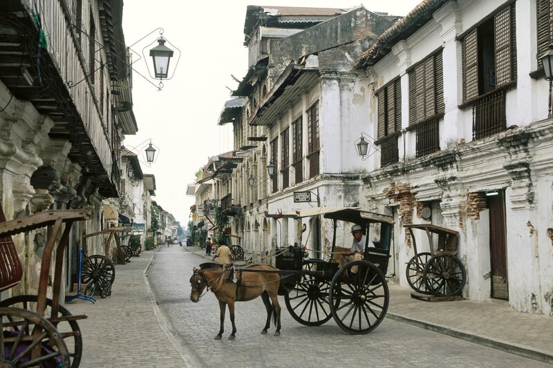 Horse-drawn carriage on a cobblestone street