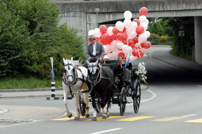 Horse-drawn carriage with balloons