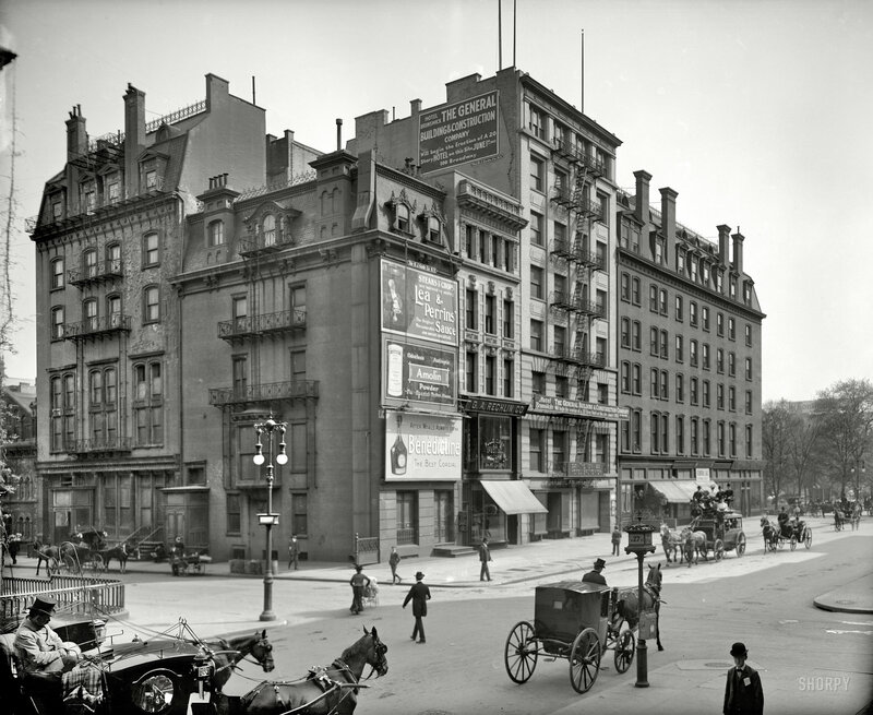 Horse-drawn carriages on a city street