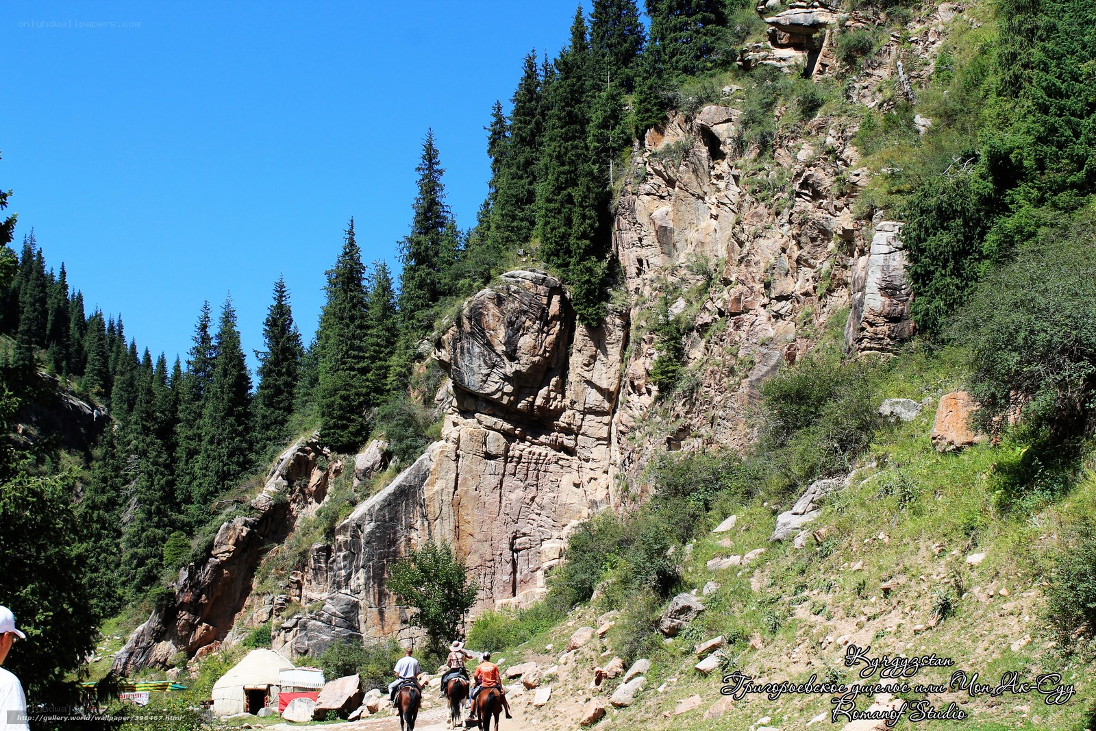 Horseback riders in mountain valley