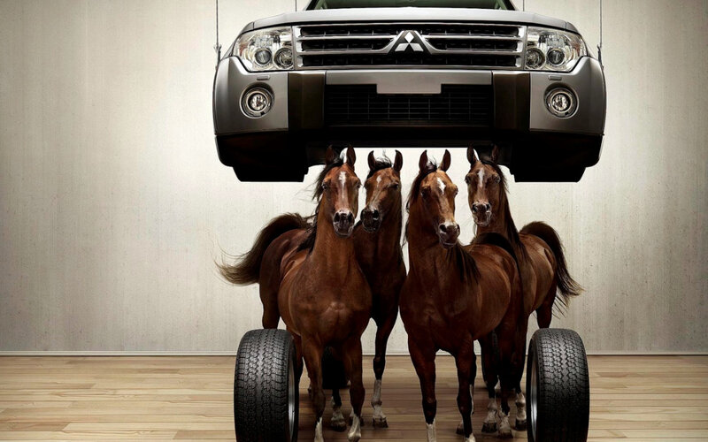 Horses lifting a car