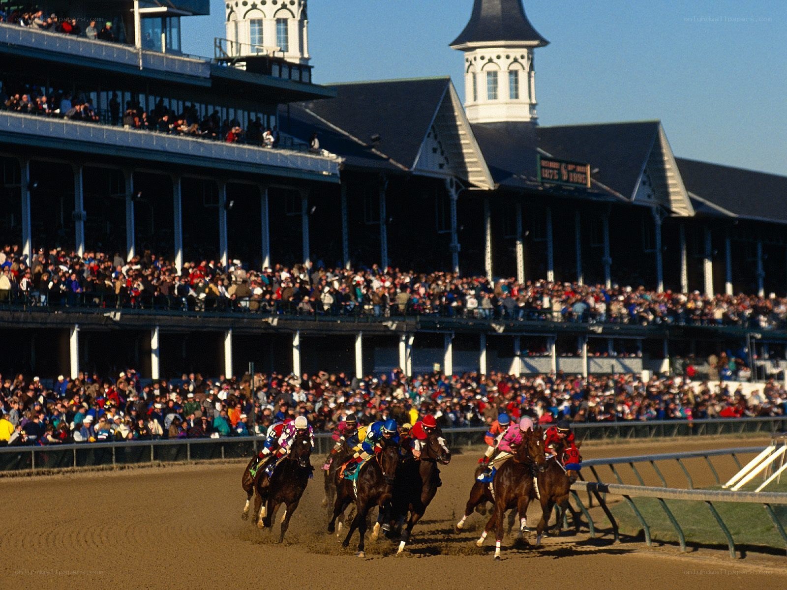 Horses racing at a track
