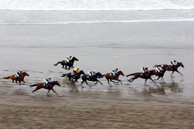 Horses Racing on Beach
