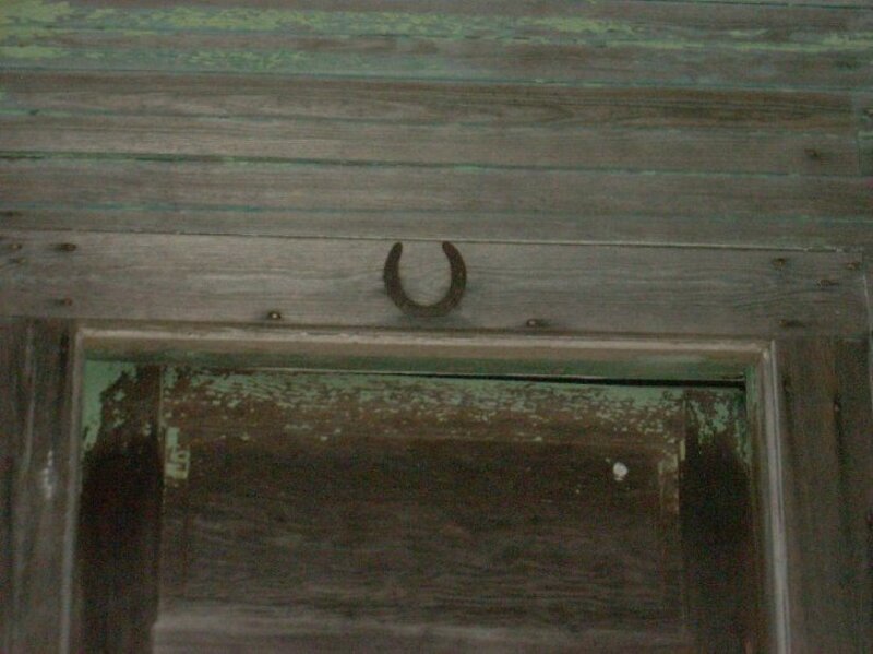 horseshoe above wooden door