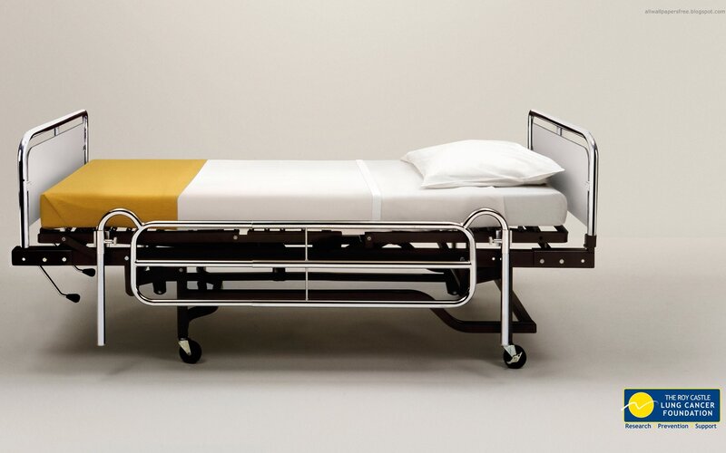 hospital bed with yellow and white bedding