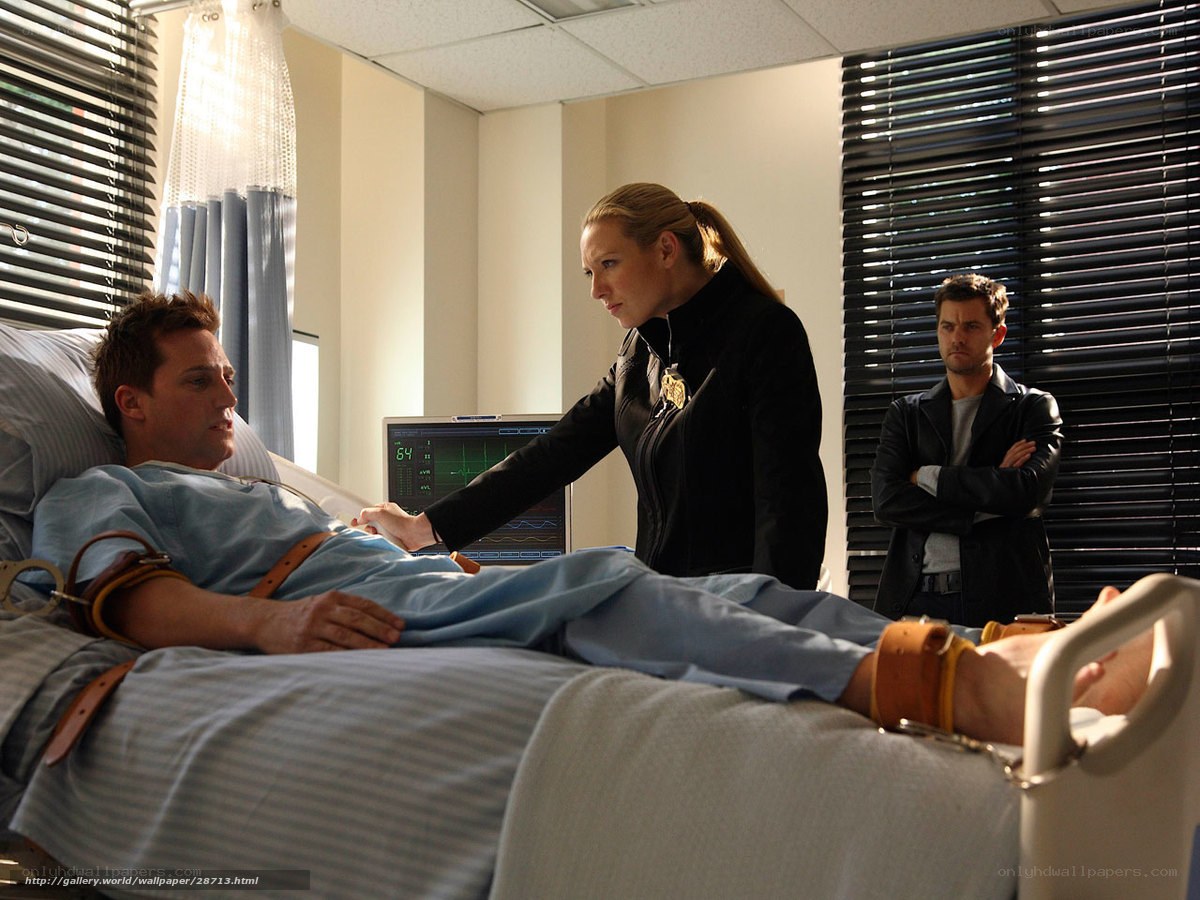 Hospital room scene with police