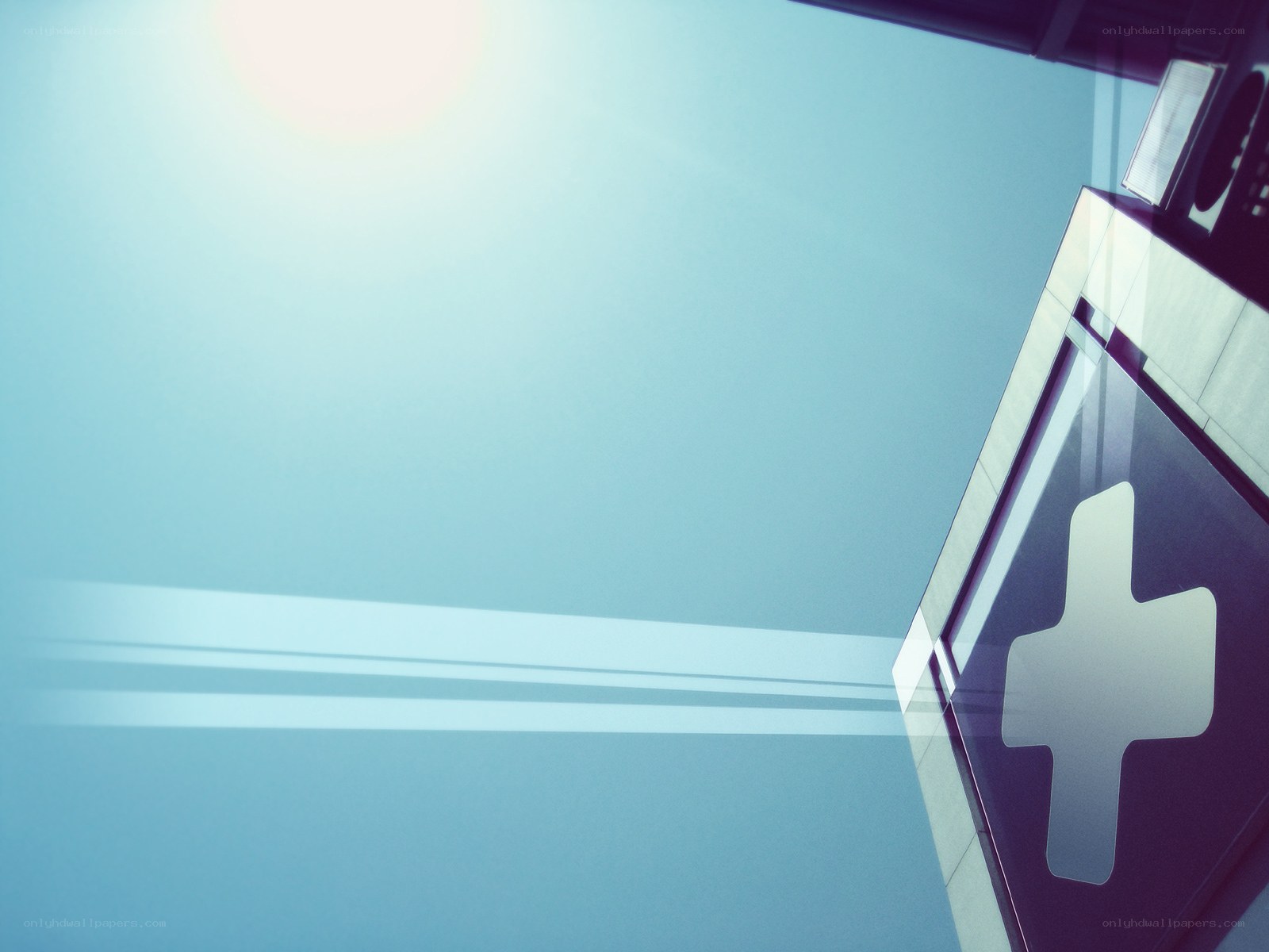 Hospital sign under bright sky