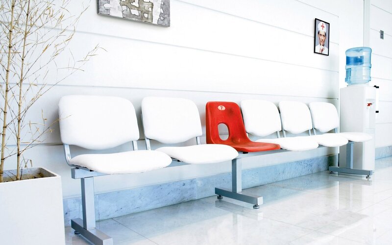 Hospital waiting area with red chair