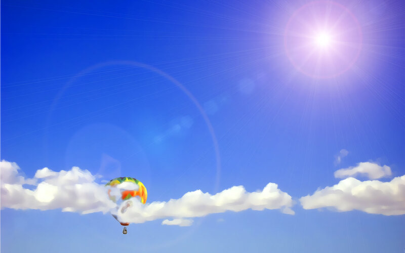 Hot air balloon in sunny sky