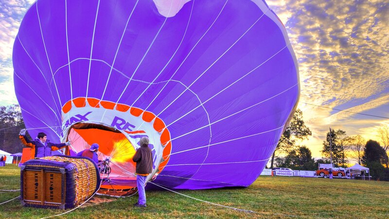 Hot air balloon inflation at sunrise