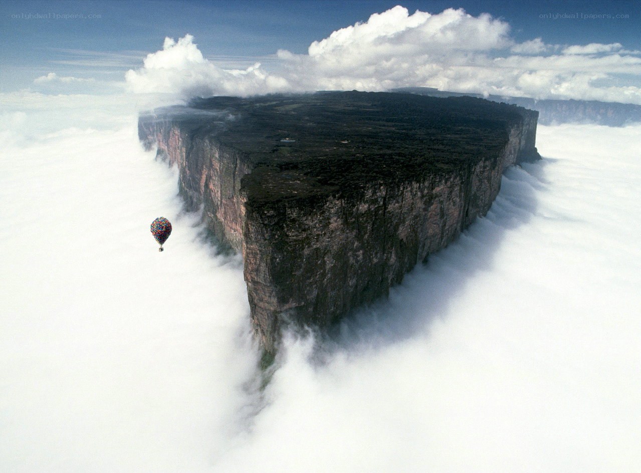 Hot air balloon over a tabletop mountain