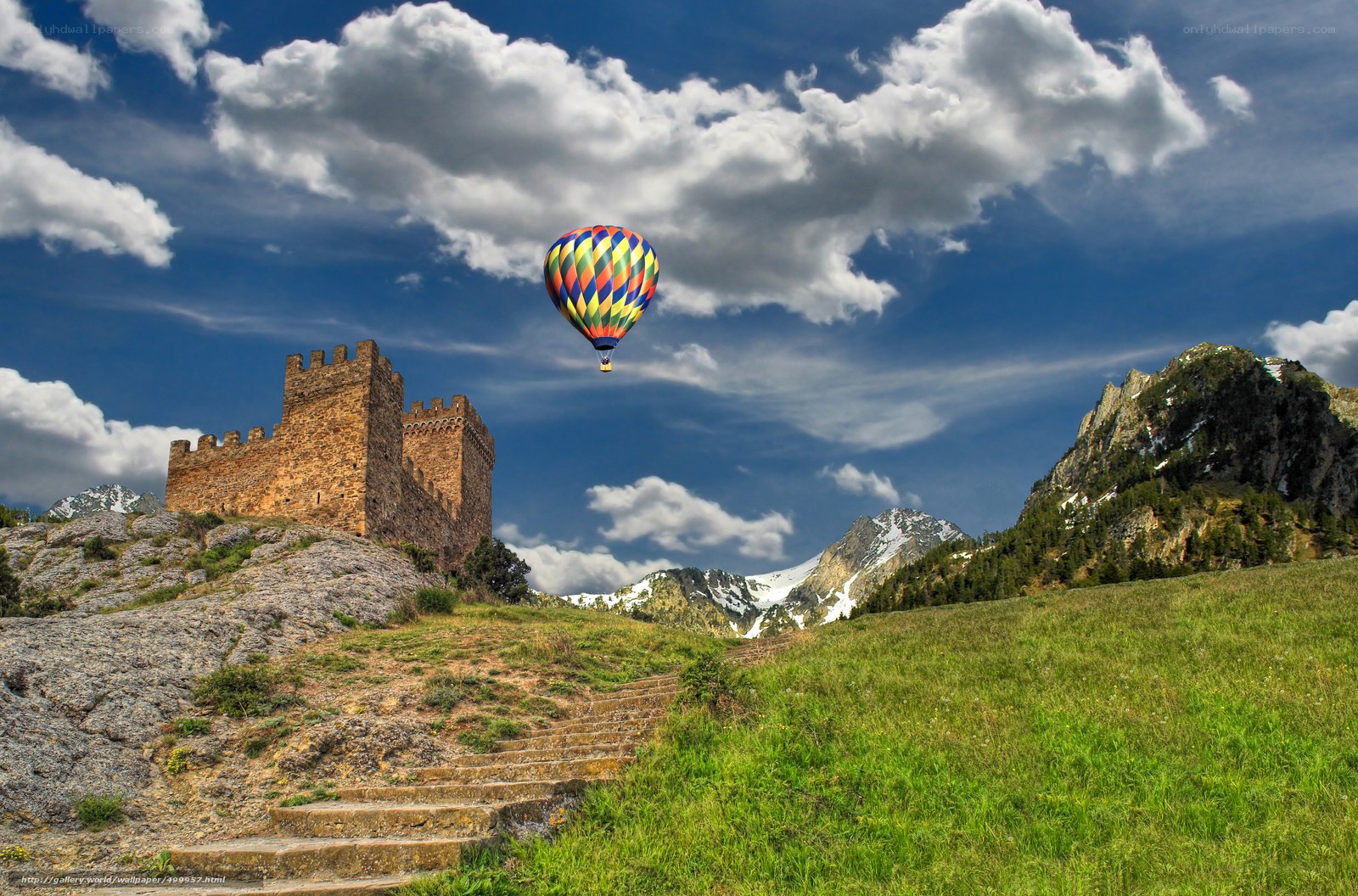 Hot air balloon over ancient castle