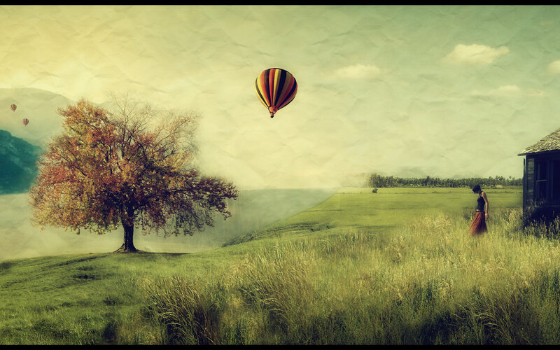 Hot air balloon over autumn field