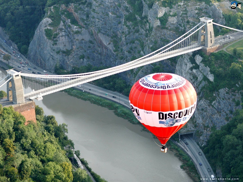 Hot air balloon over bridge