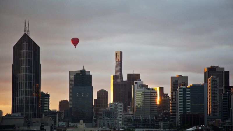 Hot air balloon over city skyline