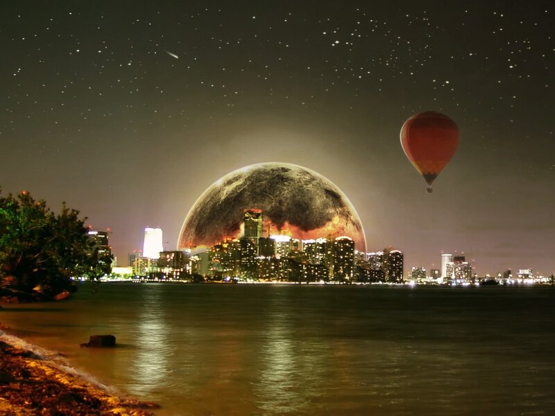 Hot air balloon over city