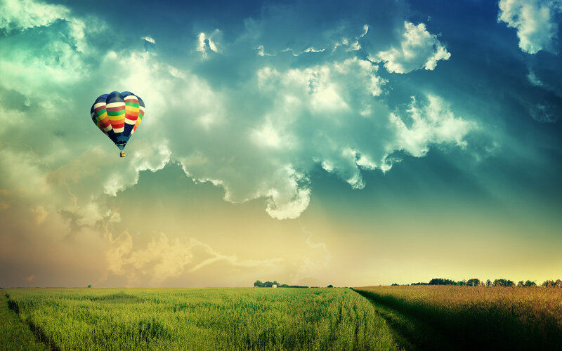 Hot Air Balloon over Field — Green, Dramatic, Sunset, Photograph, Clouds