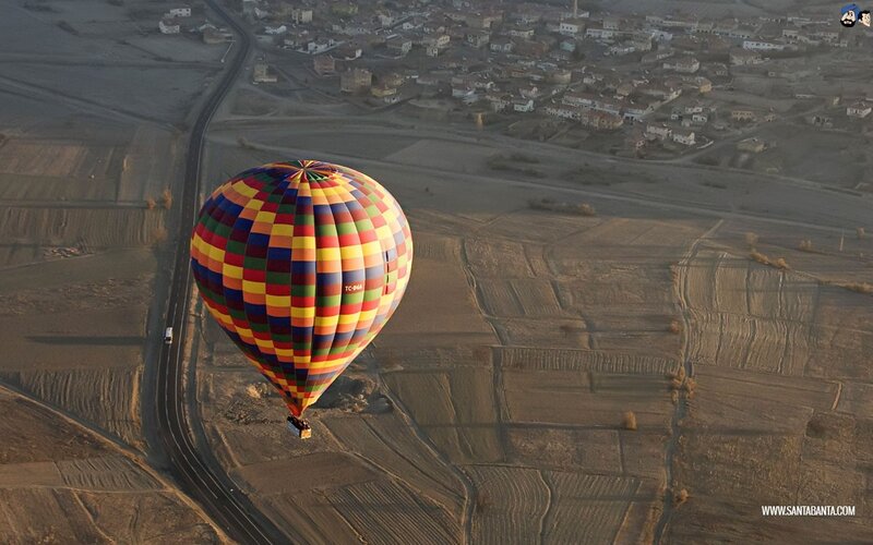 Hot air balloon over fields