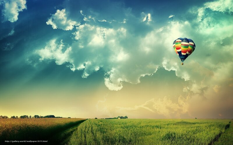 Hot air balloon over fields