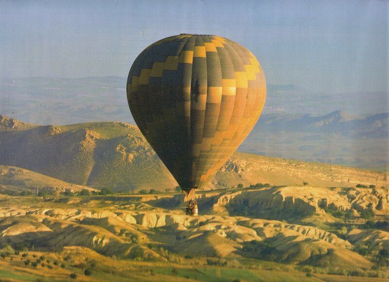Hot Air Balloon over Hills — Yellow