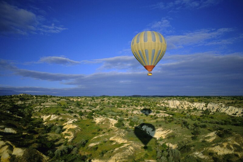 Hot Air Balloon over Landscape — Blue, Serene, Morning, Photograph, Canyon