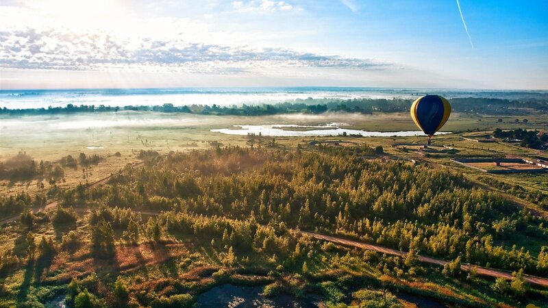 Hot Air Balloon over Landscape — Green