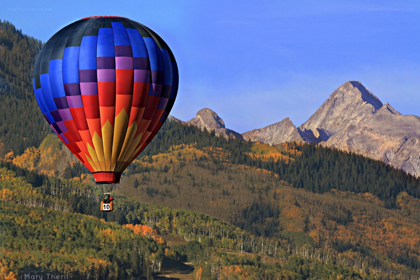 Hot air balloon over mountains