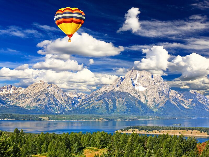 Hot Air Balloon over Mountains — Blue