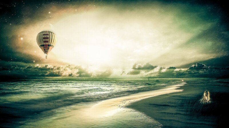 Hot air balloon over ocean