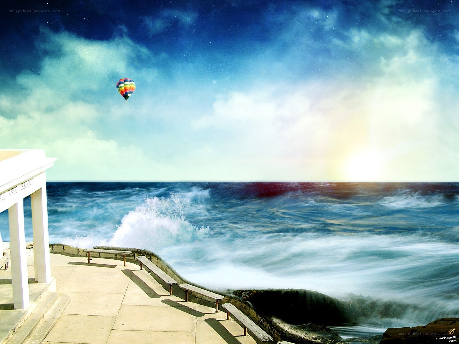Hot air balloon over ocean
