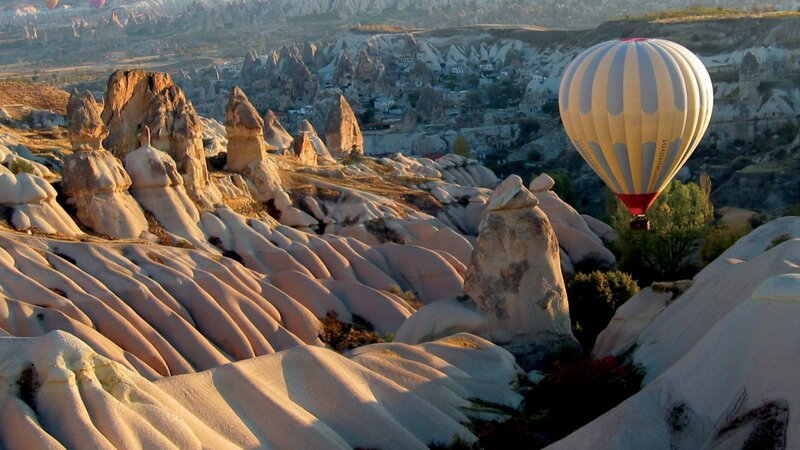Hot Air Balloon over Rock Formations — Beige