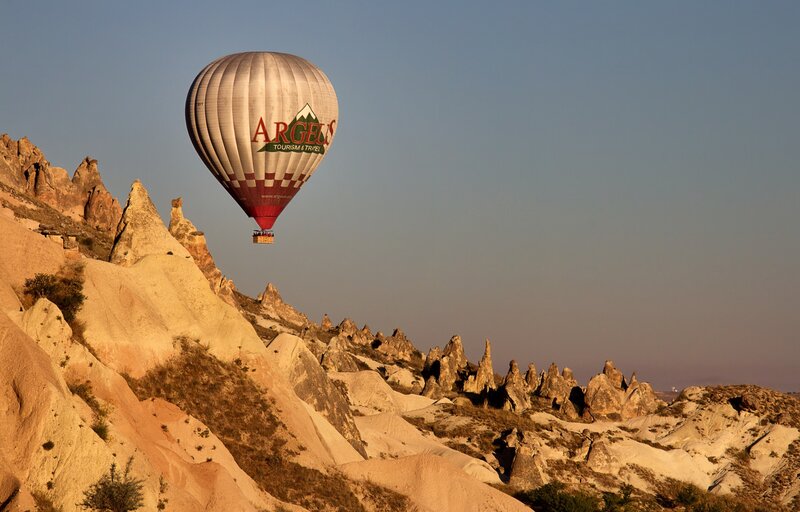 Hot Air Balloon over Rocks — Beige, Serene