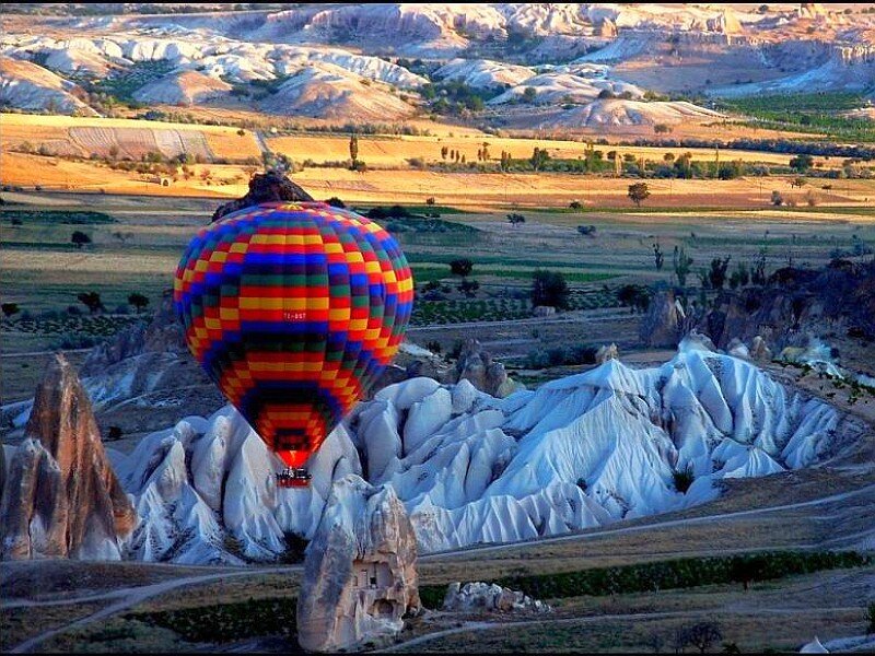 Hot Air Balloon over Rocks — White, Serene, Morning, Photograph