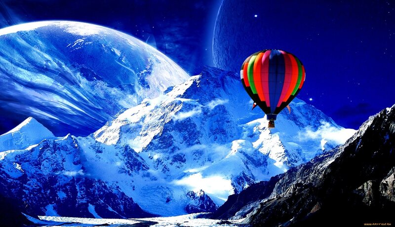 Hot air balloon over snowy mountains