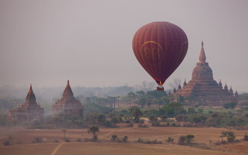 Hot Air Balloon over Temples — Brown, Serene