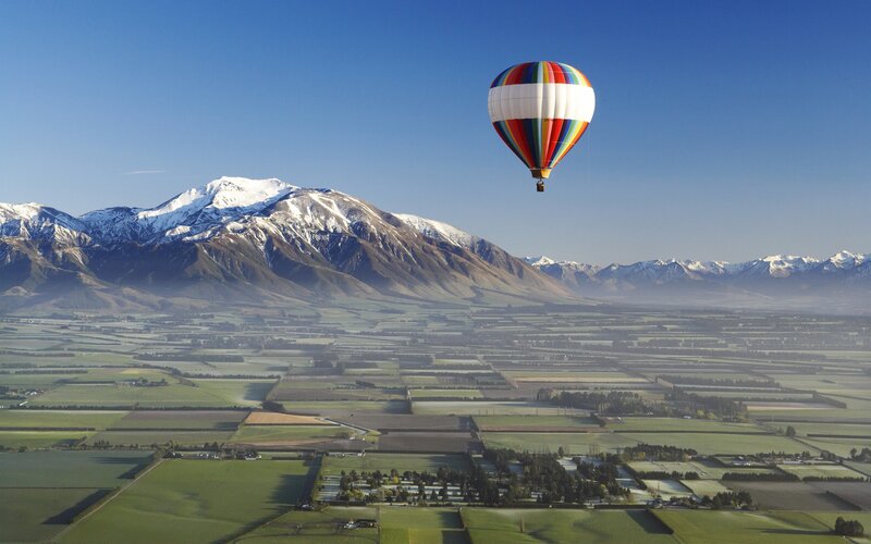 Hot Air Balloon over Valley — Blue