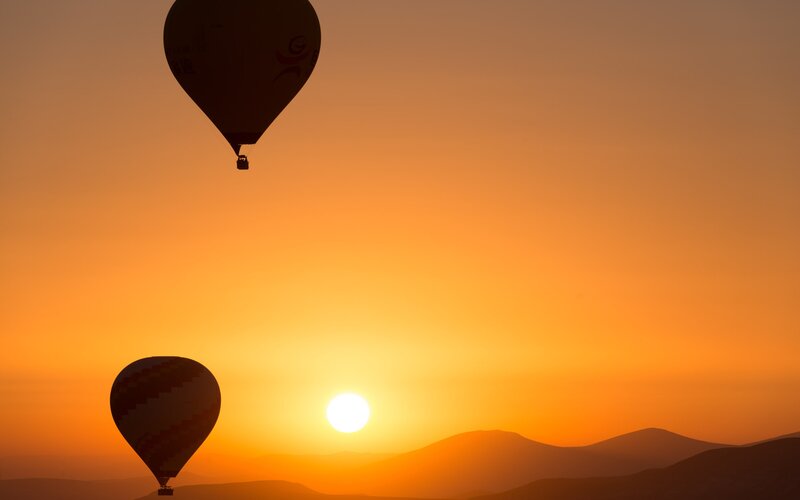 Hot Air Balloons at Sunrise — Orange, Serene, Photograph, Sun